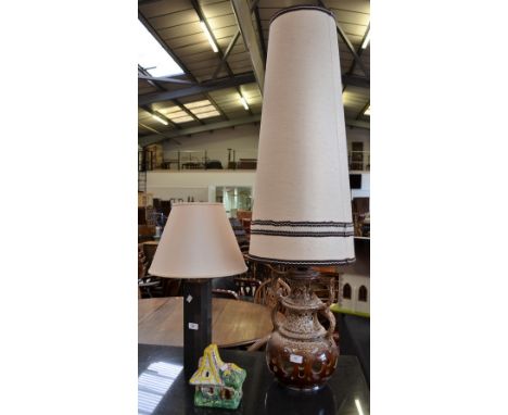 A large German lava lamp with tall shade; a slate contemporary lamp; a novelty lamp in the form of a ceramic hospital (3)
