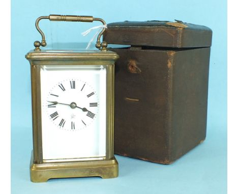 A French brass carriage timepiece, the white enamel dial with trademark, the movement stamped 'Made in France', 15cm high, in