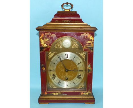 A Georgian-style red-lacquered bracket clock with arched brass dial, silvered chapter ring and "Tempus Fugit" in the arch, th