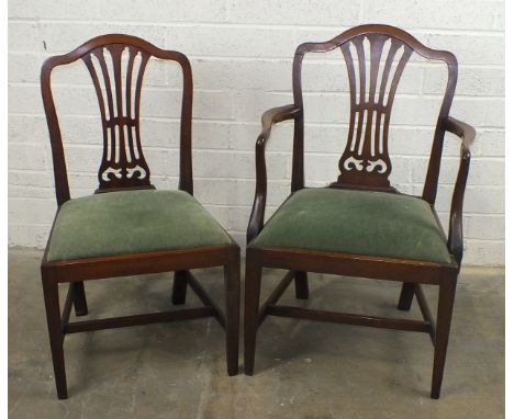 A set of  eight Chippendale style mahogany dining chairs with pierced vase splats and drop-in seats on square legs joined by 