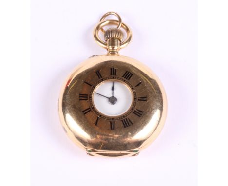 An 18ct gold cased lady's half hunter fob watch with white enamel dial