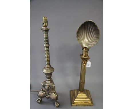 A brass Corinthian column table lamp, fitted metal shell shade, and another gilt metal table lamp, on tripod base