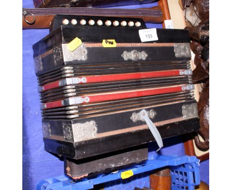 A Viceroy accordion with ten keys, a grained as rosewood accordion with twenty-one keys and a soprano recorder