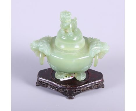 A jade koro with domed cover with Kylin knop, on ebonised wooden base