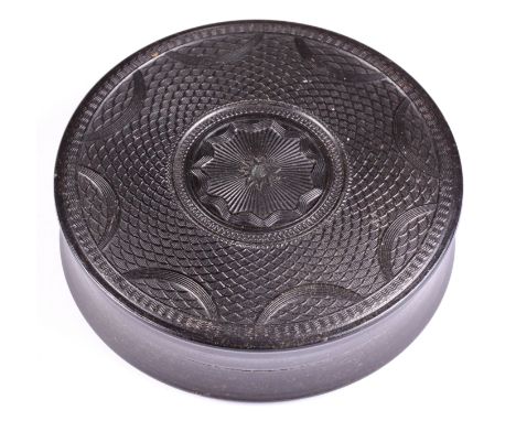 A pressed tortoiseshell circular patch box with floral and pique decoration