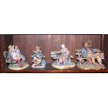 A collection of four Capodimonte figures, on benches