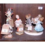 A Capodimonte figure group of children playing Ring a Ring o' Roses, a pair of Commedia dell'Arte