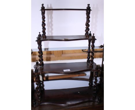 A grained as rosewood four-tier wall shelf, 18" wide