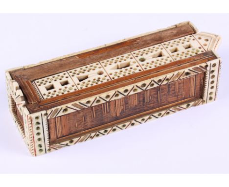 A marquetry decorated cribbage board containing bone pegs and playing cards and a miniature set of prisoner-of-war bone domin