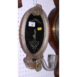A Venetian oval glass framed girandole, fitted single candle holder, plate etched lady, 12" high