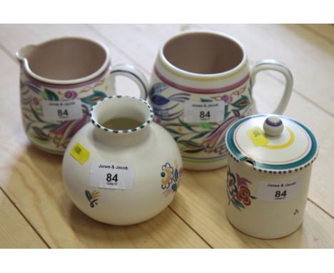 A Poole Pottery tankard and three other pieces of Poole