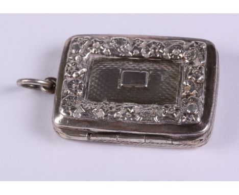 A Georgian silver vinaigrette with engine turned and embossed decoration, pierced grill and gilt interior