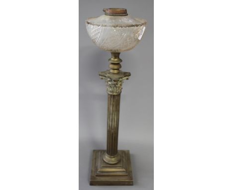 A brass Corinthian column oil lamp with glass reservoir, 25" high (burner missing)