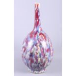 A studio pottery table lamp, formed as two figures, 17 1/2" high, and a mottled glazed sprinkler