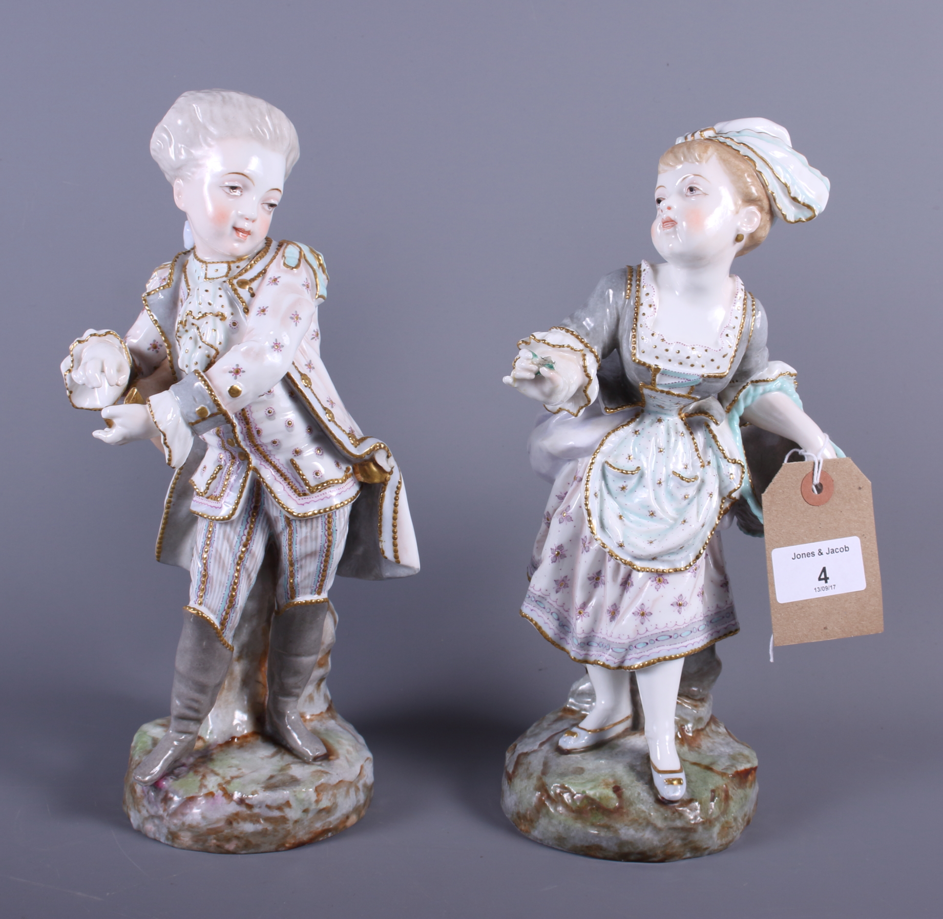 A pair of Continental porcelain figures of a boy and girl in 18th ...