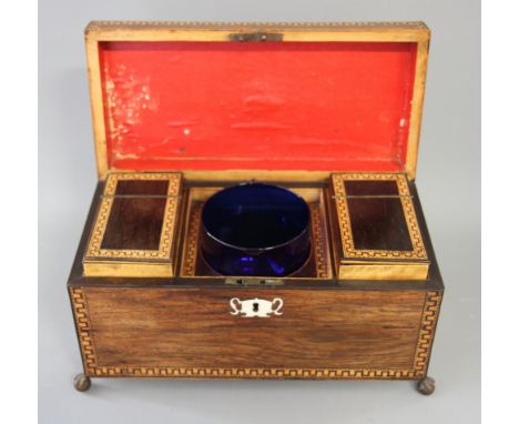 A 19th century two-compartment tea caddy with dentil design inlaid borders, ivory escutcheon and blue glass mixing bowl