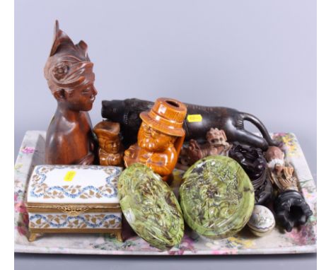 A pair of oval green glazed wall plaques with moulded cherubs, a carved wooden lion, a Limoges gilt metal mounted trinket box