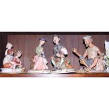 Four Capodimonte figures of a street musician, lady on a bench, an old seaman and three children