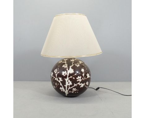 A modern oriental style table lamp and shade. Height overall 70cm, diameter of base 35cm.Fitted with European two-prong plug.
