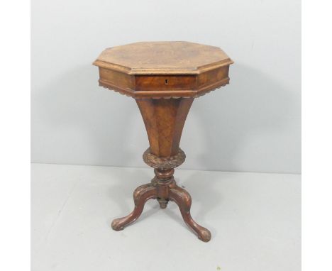 A Victorian walnut octagonal trumpet sewing work table on tripod base. 44x73cm. 