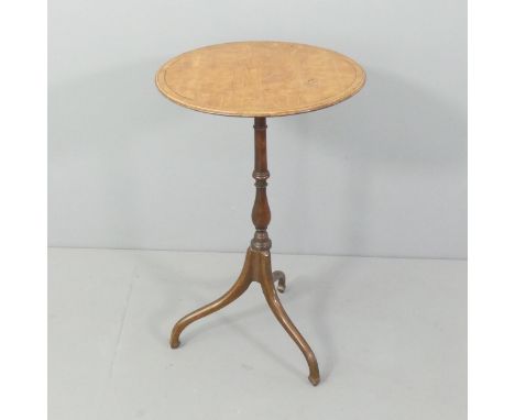 An antique crossbanded walnut and mahogany circular topped occasional table, with turned central column and tripod base. 73x7