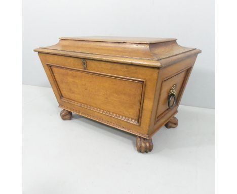 An antique style oak cellarette in the form of a sarcophagus tea caddy, lacking liner. 77x50x50cm. 