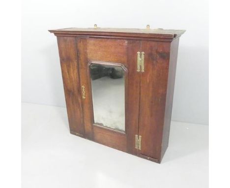 A 19th century mahogany hanging cabinet, with single mirrored door and shelf fitted interior with two drawers below. 93x92x27