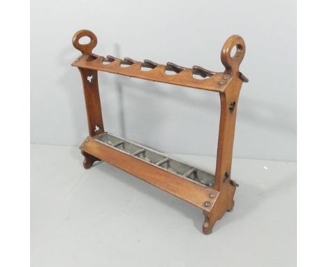 An antique mahogany Arts & Crafts gothic style stick / umbrella stand, with drip tray and pierced decoration. 84x75x23cm.Good