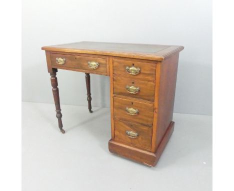 A Victorian mahogany writing desk with tooled and embossed skiver, 5 drawers and art nouveau style handles. 92x75x49cm. 