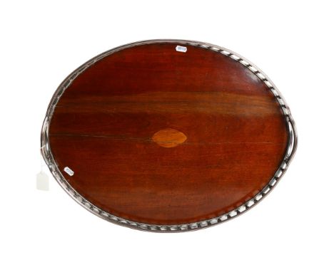 A large oak serving tray, with silver plate and copper gallery surround, 46cm x 59cm 