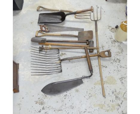 Eleven various agricultural tools, including a scythe, forks, hammers etc. All marked, including Stourbridge, Bulldog, etc. S