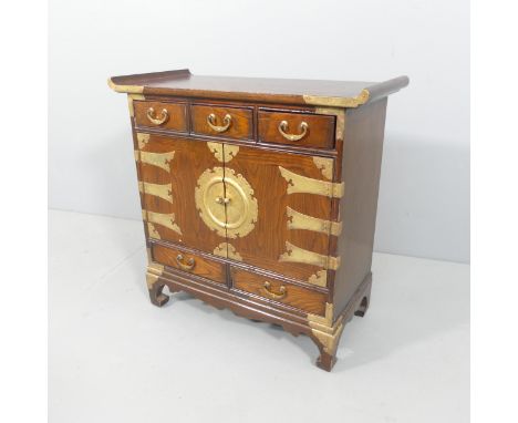 A Korean elm altar cabinet, with brass mounts, two cupboards and five drawers. 66x66x30cm. 