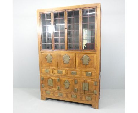 A Korean two-section cabinet, with two bi-fold doors, eight drawers, two fall-front doors and two cupboards. 131x202x47cm. 