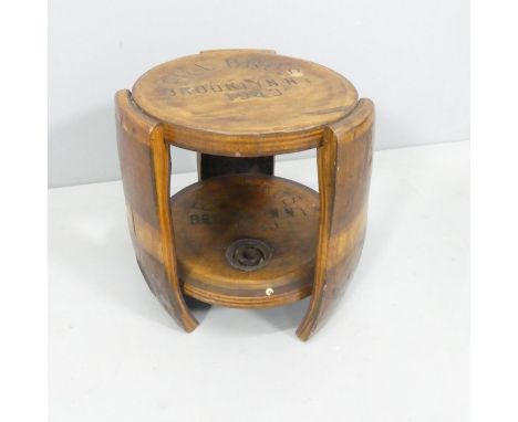 A vintage oak two-tier barrel seat, inscribed "Piel Bros, Brooklyn, N.Y, 1940. 35x38cm. 