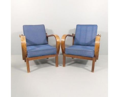 A pair of 1930s Art Deco reclining lounge chairs with bentwood arms.Some movement in the joints. Some use related marks and s