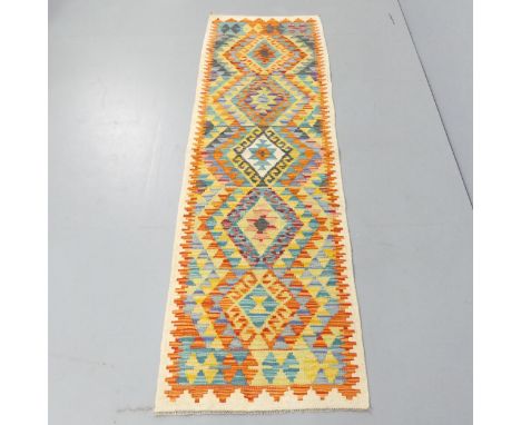 A Chobi Kilim runner. 204x64cm. 