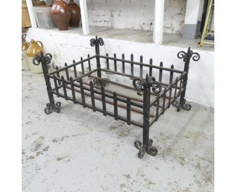 A large wrought iron log basket / grate. 114x54x84cm. 