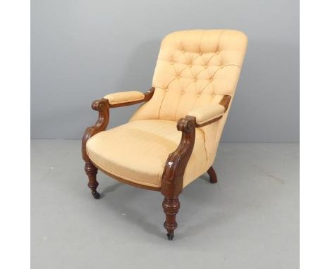 A Victorian mahogany and button-back upholstered open arm chair. 