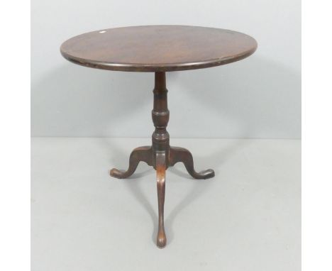 A 19th century mahogany circular tilt-top occasional table, on turned central column with tripod base. 56x59cm. 