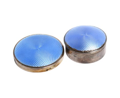 A George V silver and blue enamel circular box and cover, diameter 5cm, and a matching George V silver and blue enamel compac