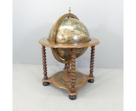 A terrestrial globe design drinks / cocktail cabinet raised on barley twist columns with platform base. 72x98cm.Good used con