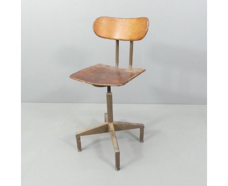 A vintage machinist's stool with revolving rise and fall mechanism. 