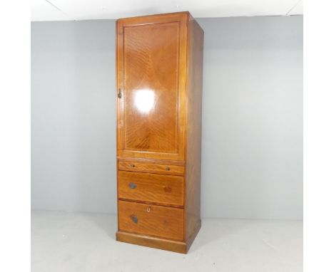 An Edwardian mahogany and checkerboard strung single wardrobe, with shelf fitted interior and three drawers under. 64x194x55c