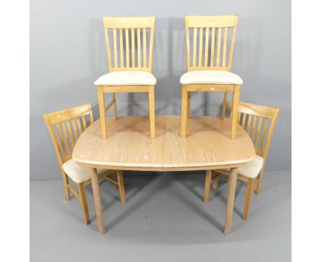 A modern light oak draw-leaf dining table, 137 (extending to 174cm)x75x95cm, and four beach and upholstered dining chairs. 
