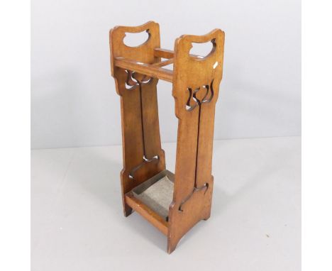 An antique oak Arts & Crafts stick stand, with pierced decoration and original metal drip tray. 32x86x29cm. 