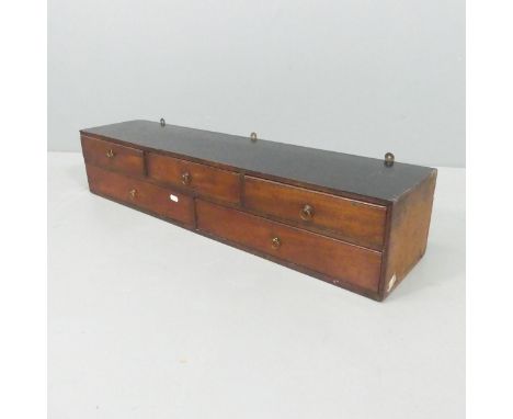 A vintage mahogany hanging bank of five drawers. 92x18x23cm. 