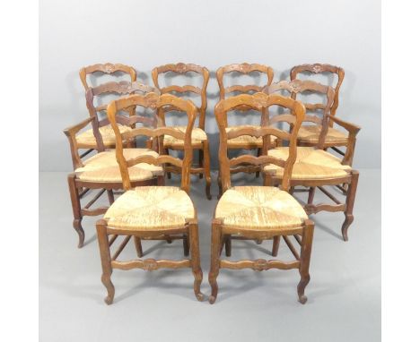 A set of eight French oak ladder-back rush-seated dining chairs. (6+2) 