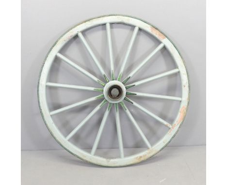 A vintage painted cartwheel with metal tire. Diameter 109cm. 