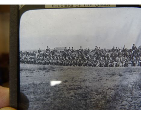 A box of Magic Lantern Slides, including war ships at sea, a number from the Transvaal in War series etc.