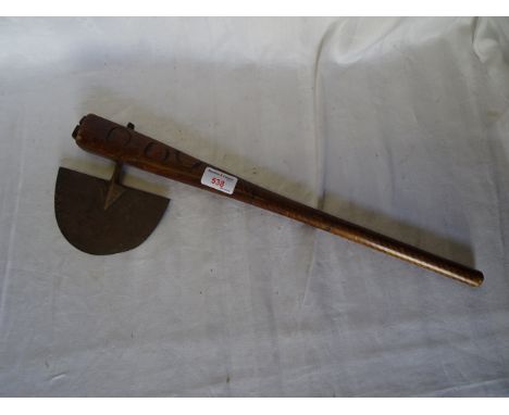 An African Axe with wooden haft and half moon blade.  19" (48cms) long. 